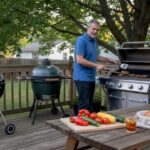 Man grilling with three types of outdoor grills